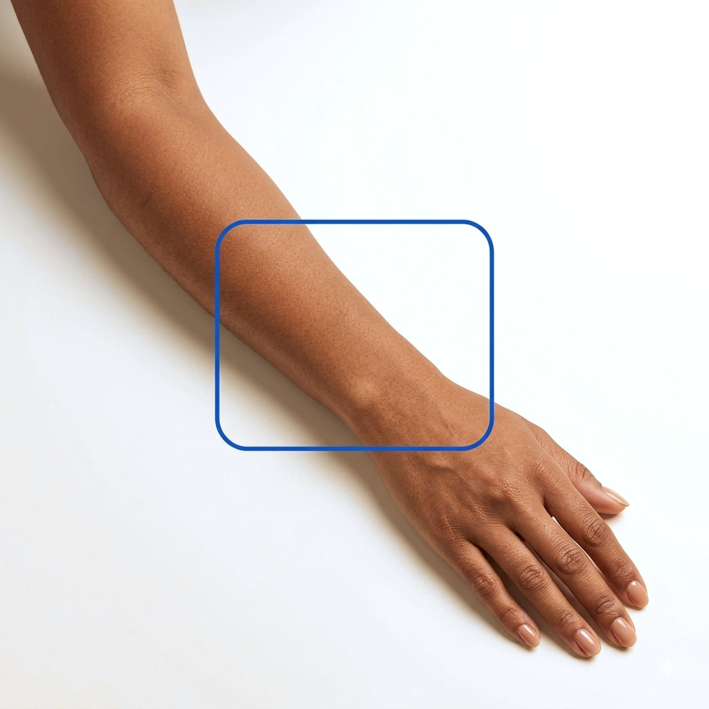 Arm on a table with a guided capture frame highlighting the body area being analyzed